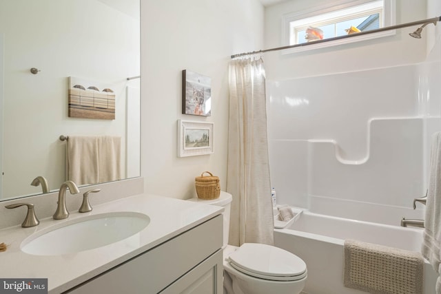 full bathroom featuring vanity, toilet, and shower / bath combo with shower curtain