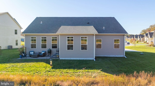 back of property with a yard, a patio area, and central AC unit