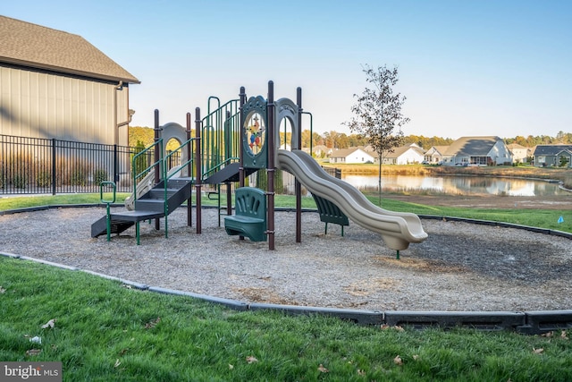 view of jungle gym with a water view