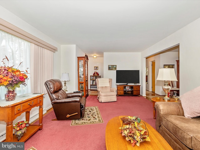 living room featuring carpet floors and baseboard heating