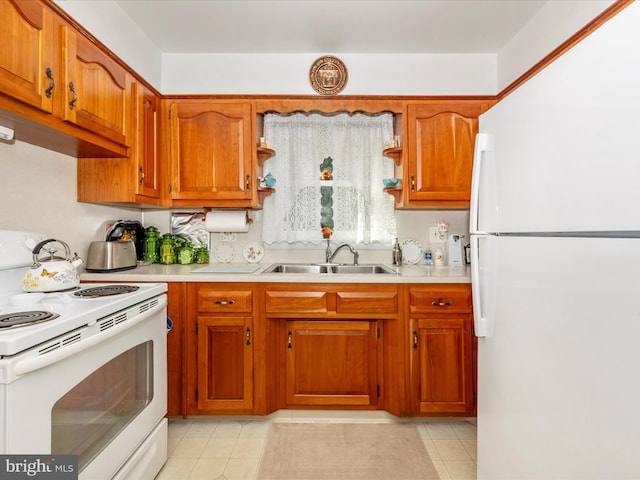 kitchen featuring white appliances, light tile patterned flooring, and sink