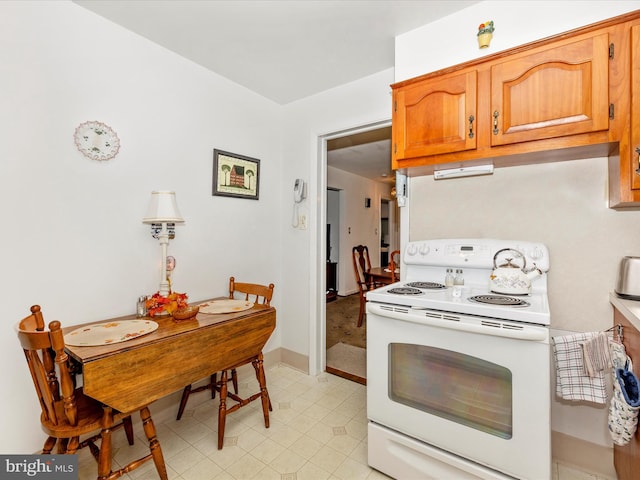 kitchen with white range with electric stovetop