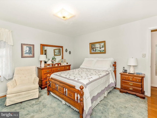 bedroom with light hardwood / wood-style floors