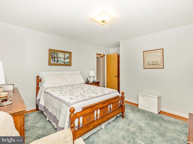 bedroom with wood-type flooring