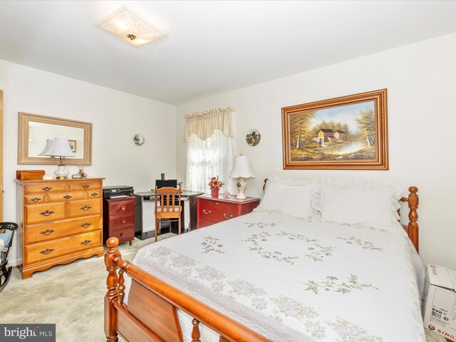 bedroom featuring light colored carpet