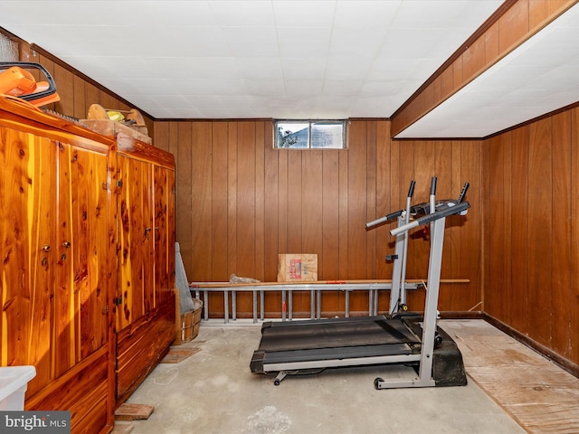 workout area featuring wooden walls