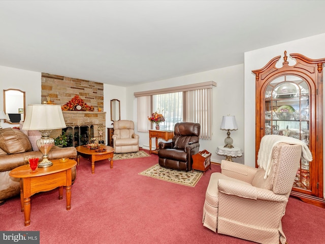 carpeted living room with a stone fireplace and a baseboard radiator