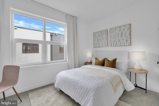 bedroom with light colored carpet