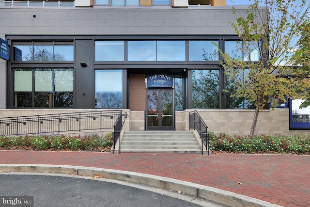 view of exterior entry featuring french doors