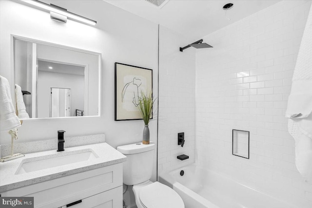 full bathroom with vanity, toilet, and tiled shower / bath