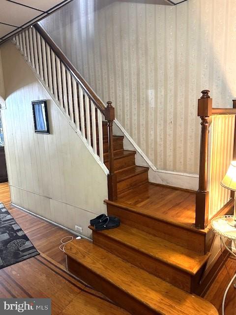 stairway with wood-type flooring