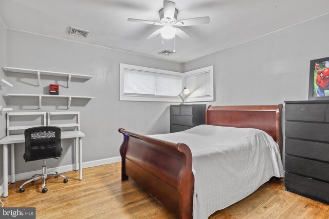 bedroom featuring ceiling fan and wood-type flooring