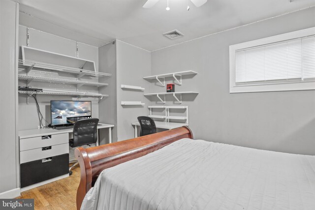 bedroom with light hardwood / wood-style flooring and ceiling fan