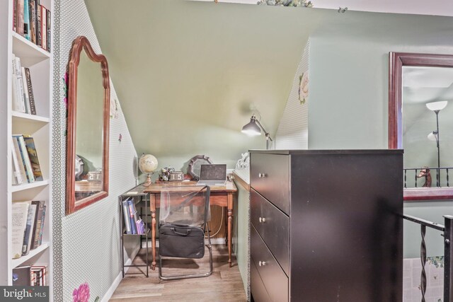 office space with sink and light hardwood / wood-style floors