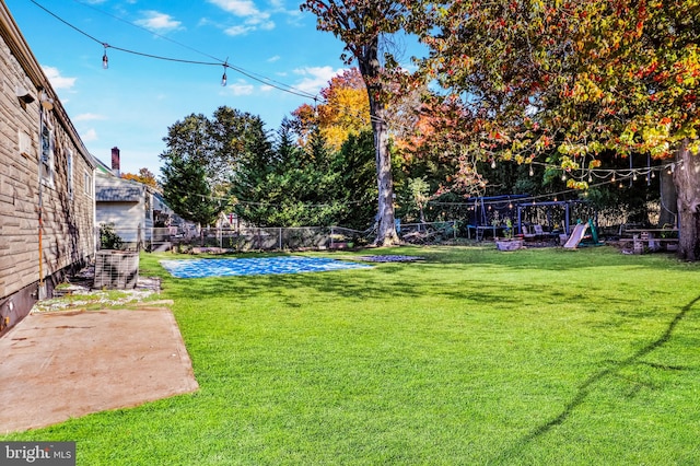 view of yard featuring a trampoline