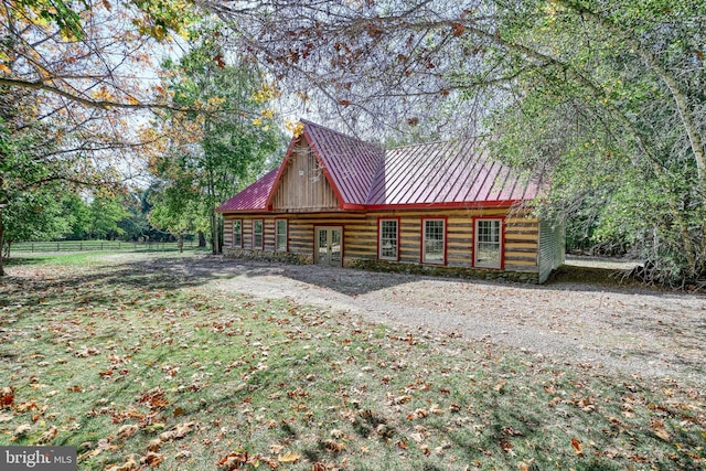 995 Black Gap Rd, Fayetteville, PA 17222 - exterior space featuring a standing seam roof, metal roof, log exterior, french doors, and fence