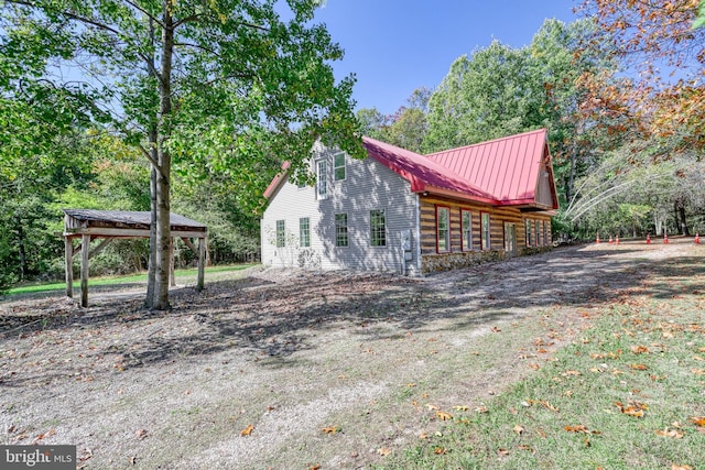 view of property exterior featuring a gazebo