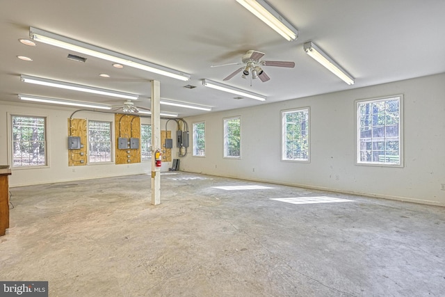 unfurnished room featuring electric panel and ceiling fan