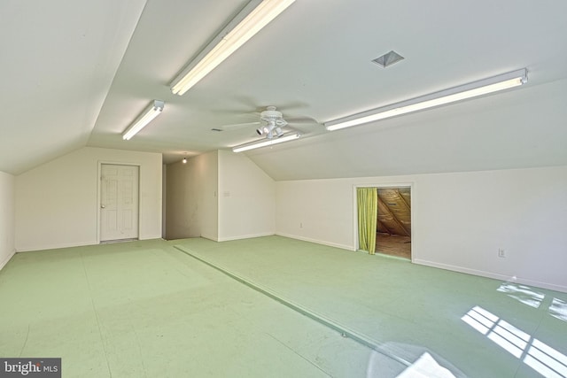 additional living space with vaulted ceiling and ceiling fan