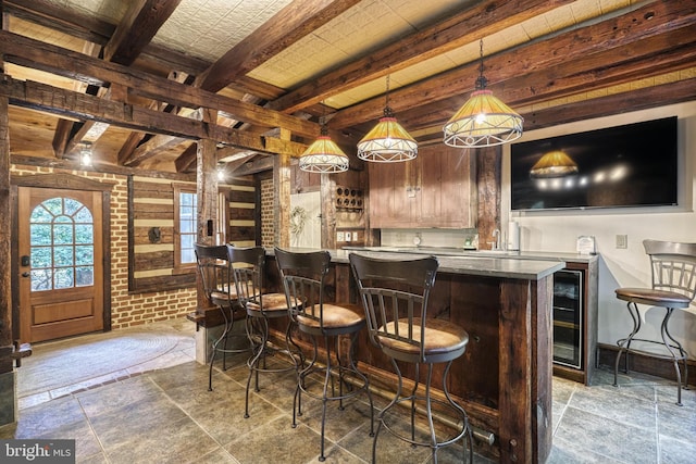 bar featuring beamed ceiling and hanging light fixtures