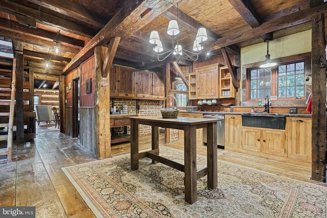 interior space featuring wood walls, sink, dishwasher, beam ceiling, and dark hardwood / wood-style floors