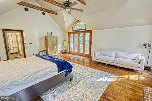 bedroom with french doors, beam ceiling, hardwood / wood-style floors, high vaulted ceiling, and ceiling fan