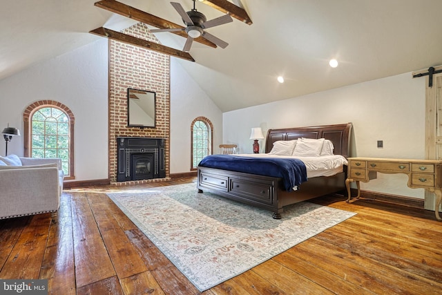 bedroom with beam ceiling, wood-type flooring, high vaulted ceiling, and ceiling fan