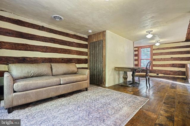995 Black Gap Rd, Fayetteville, PA 17222 - living room featuring wooden walls, visible vents, and wood-type flooring