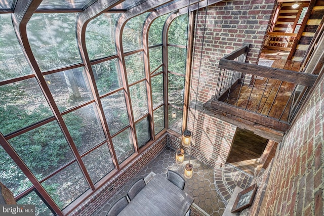 unfurnished sunroom featuring a wealth of natural light