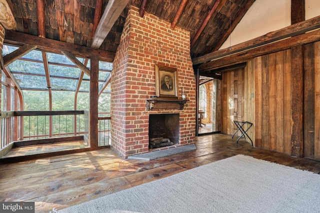 995 Black Gap Rd, Fayetteville, PA 17222 - unfurnished living room with plenty of natural light, hardwood / wood-style floors, high vaulted ceiling, and a brick fireplace