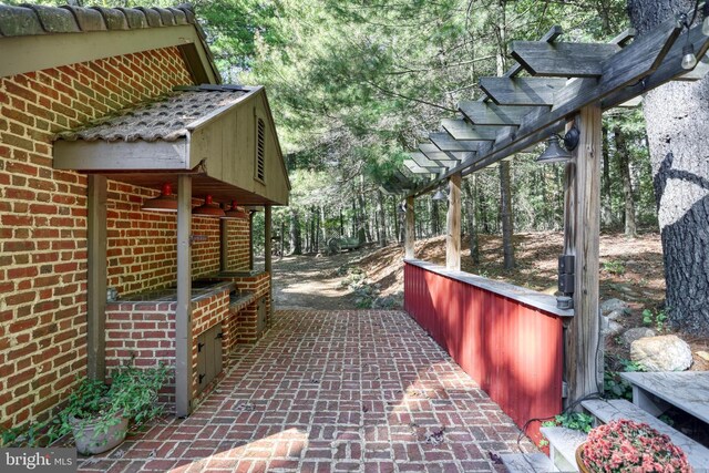 995 Black Gap Rd, Fayetteville, PA 17222 - view of side of property with a pergola, a patio area, and brick siding