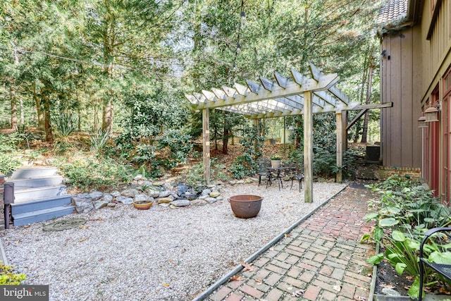 view of patio with a pergola and central AC unit