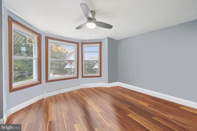 unfurnished room with wood-type flooring and ceiling fan