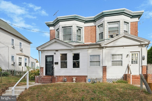 view of front of home featuring cooling unit