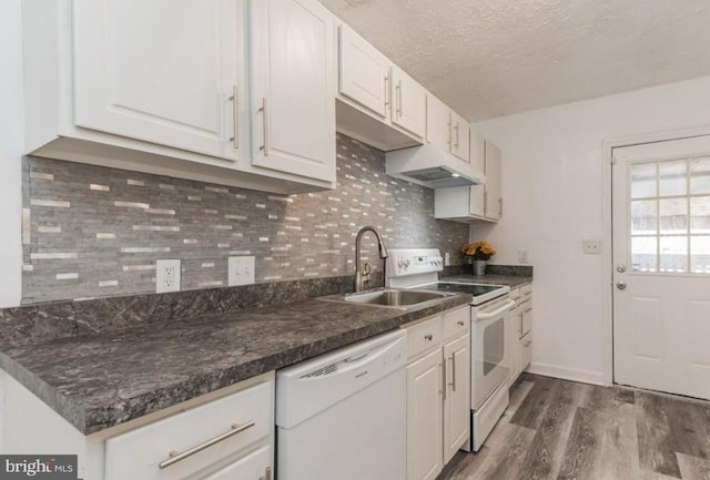 kitchen featuring dark hardwood / wood-style flooring, a textured ceiling, white cabinetry, sink, and white appliances