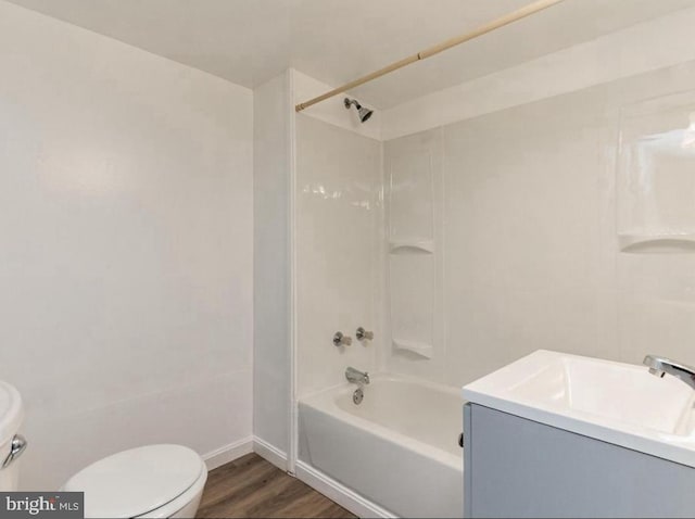 full bathroom featuring vanity, hardwood / wood-style flooring, toilet, and shower / bath combination