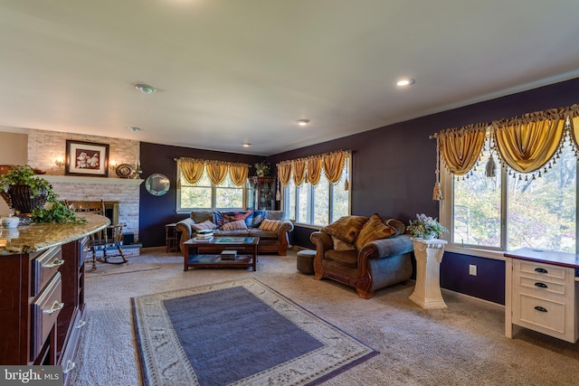 living room featuring carpet flooring and a brick fireplace