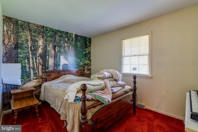 bedroom with heating unit and carpet floors