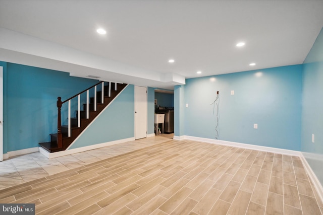 basement featuring light hardwood / wood-style floors