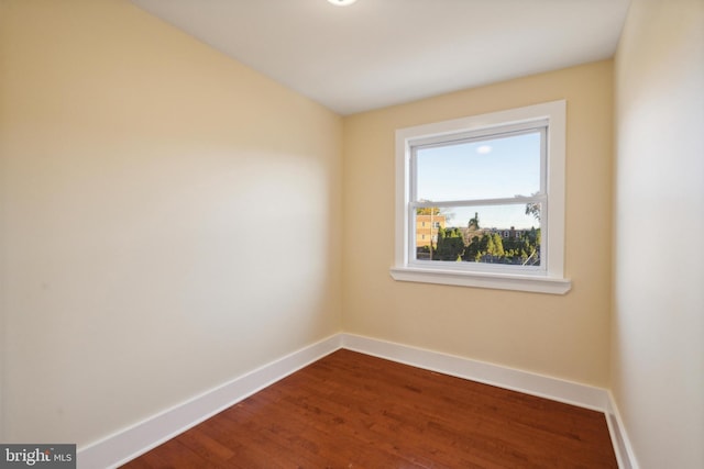 empty room with wood-type flooring