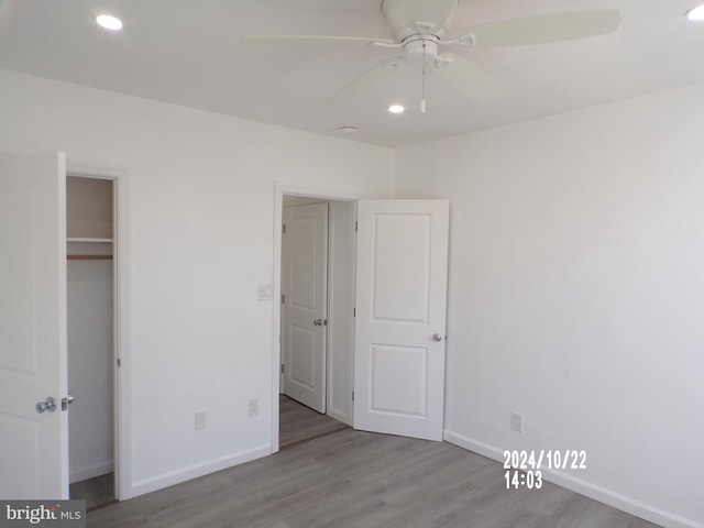 unfurnished bedroom featuring a closet, ceiling fan, and light hardwood / wood-style floors