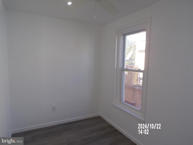 empty room featuring ceiling fan and dark hardwood / wood-style floors