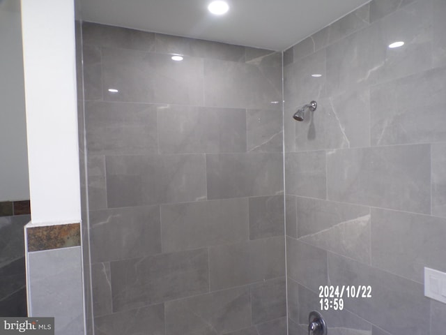 bathroom with a tile shower