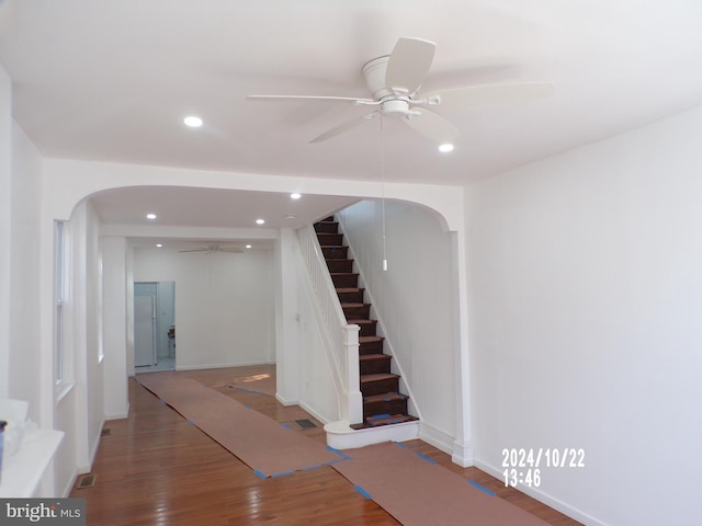 staircase featuring hardwood / wood-style floors