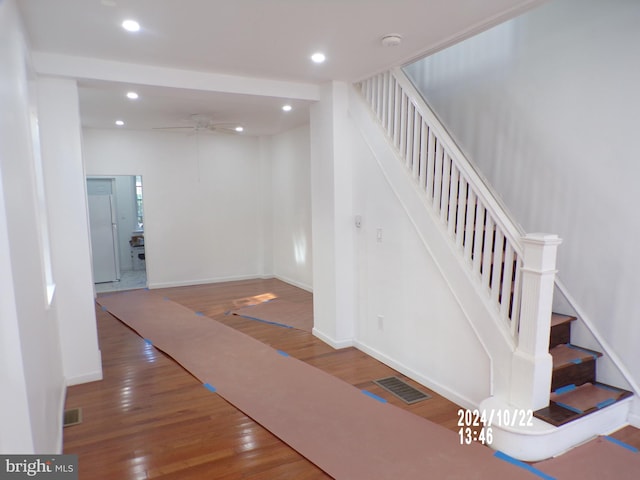 stairs featuring wood-type flooring