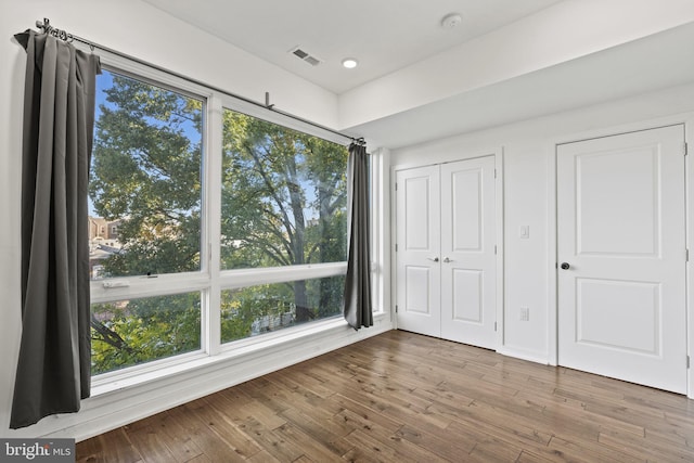 unfurnished bedroom featuring hardwood / wood-style flooring