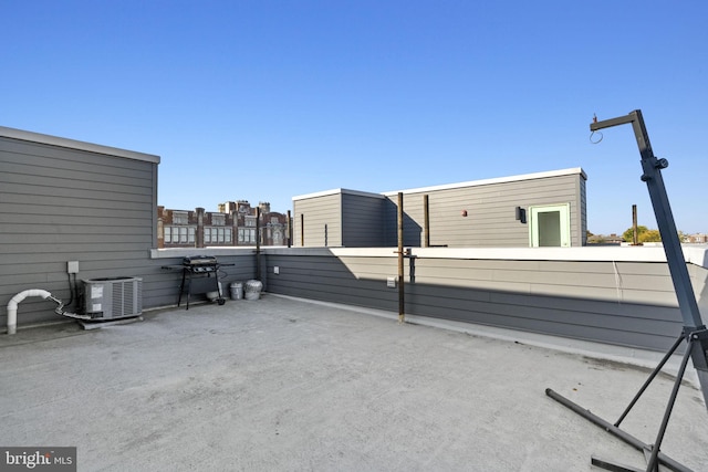 view of patio / terrace with central air condition unit, a grill, and fence