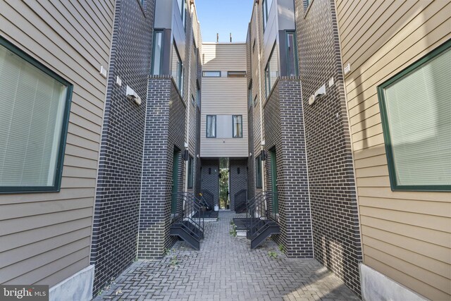 doorway to property featuring a patio area