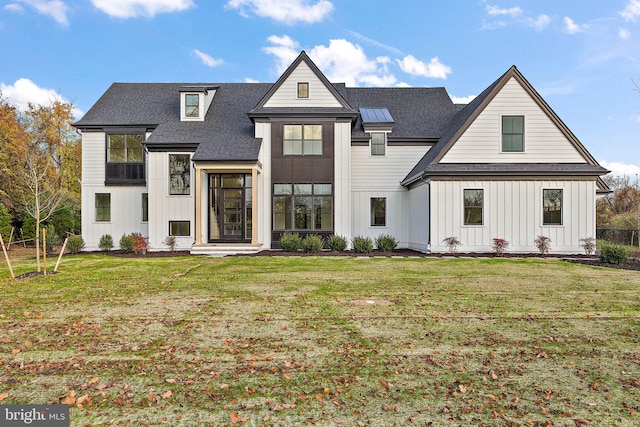 modern farmhouse with a front yard