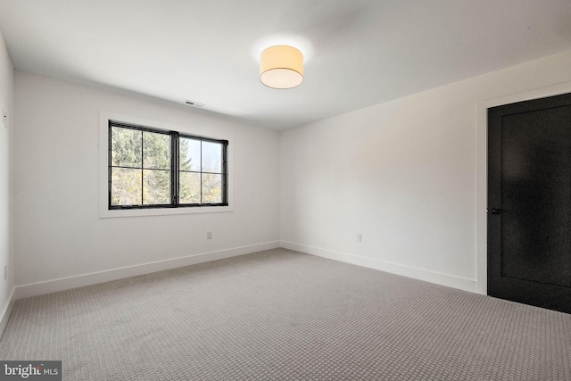 spare room with carpet floors